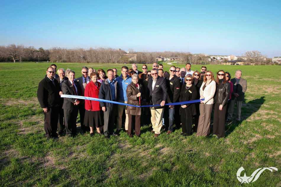 City officials and members of the B/CS Chamber of Commerce cut the ribbon.