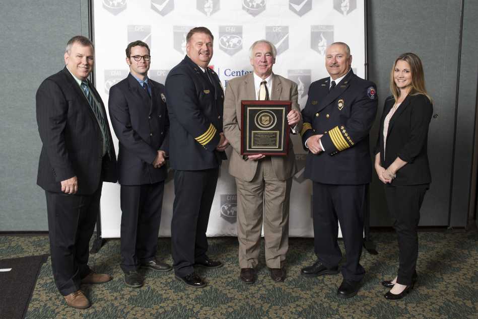 (L-R): CFAI Peer Team Leader Scott Avery, Driver/Engineer Stuart Marrs, Assistant Chief Paul Gunnels, CFAI Commission Chair Steven Westermann, Fire Chief Eric Hurt, Public Education Officer Christina Seidel.